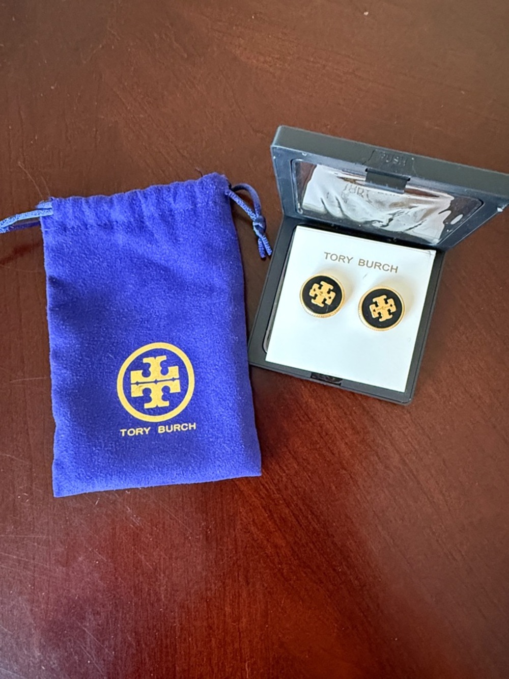 Black and gold Tory Burch earrings